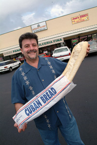 Jorge with loaf of Cuban bread