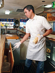 Man cutting pork roast